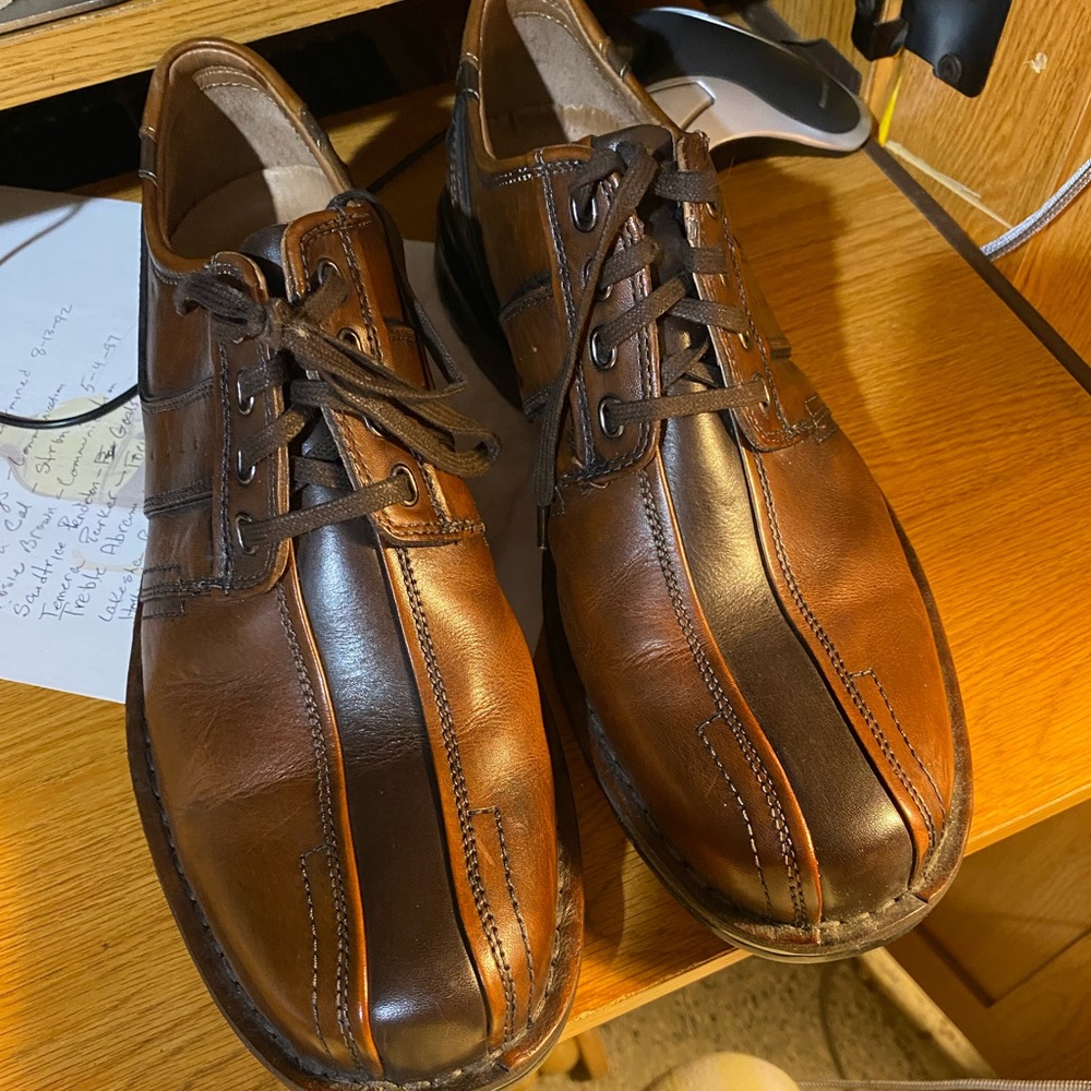 Men’s gently used two tone leather shoes.